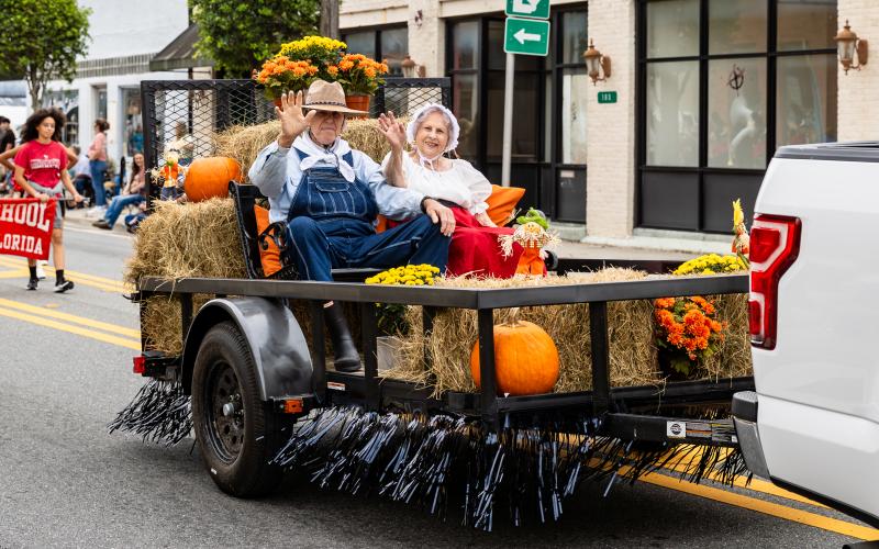 Pioneer Day ‘Granny and Pappy’ Elvoy and Betty Land wave as they serve as the grand marshals of the festival’s parade Saturday in Mayo. (JACK HOWDESHELL/Special to the Reporter)