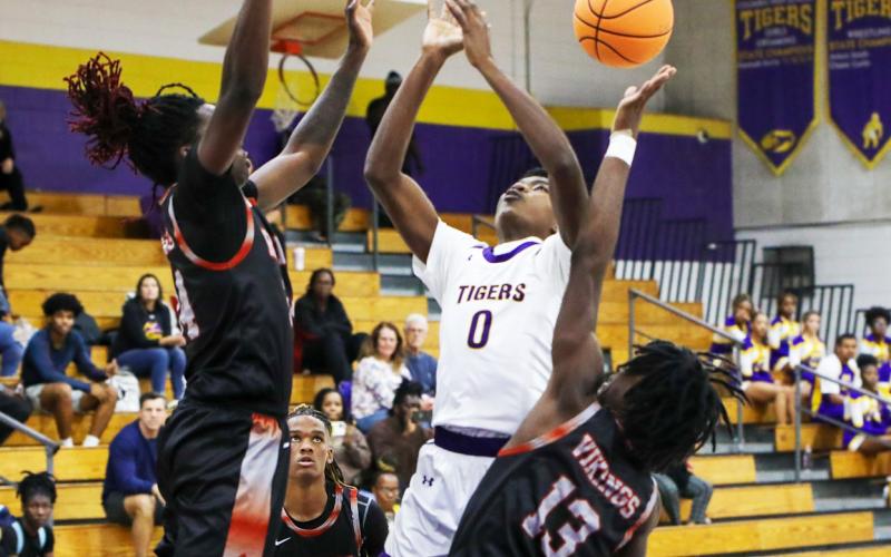 Columbia guard Noah Wilson has the ball knocked away by Raines guard Ta’veon Dunbar during Tuesday’s preseason game. (BRENT KUYKENDALL/Lake City Reporter)