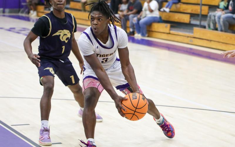 Columbia guard Zamarion Jones drives into the lane against St. John Paul II during Thursday's preseason game. (BRENT KUYKENDALL/Lake City Reporter)