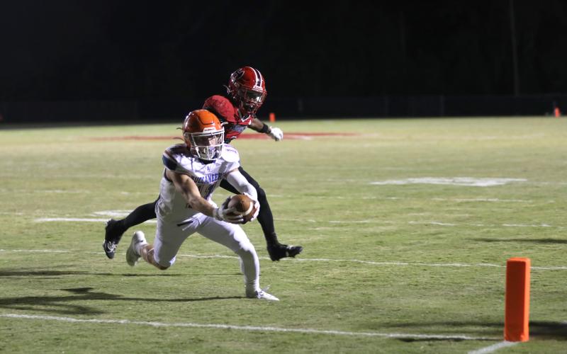 Branford receiver Austin Malaguti stretches across the goal line for a touchdown Friday against Hamilton County. (ERIN ROBERTS/Special to the Reporter)