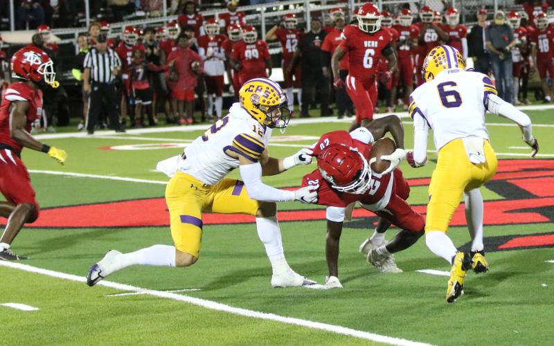 Columbia receiver Camdon Frier horse-collar tackles Vero Beach defensive back Elijah Anderson after Anderson intercepted a pass on Friday. (JORDAN KROEGER/Lake City Reporter)