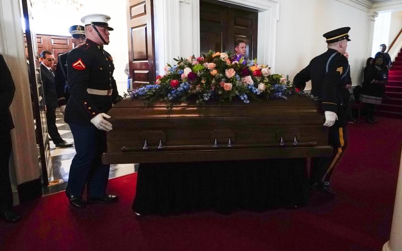 An Armed Forces body bearer team moves the casket for former first lady Rosalynn Carter into Glenn Memorial Church at Emory University for a tribute service on Tuesday in Atlanta. (BRYNN ANDERSON/Associated Press)