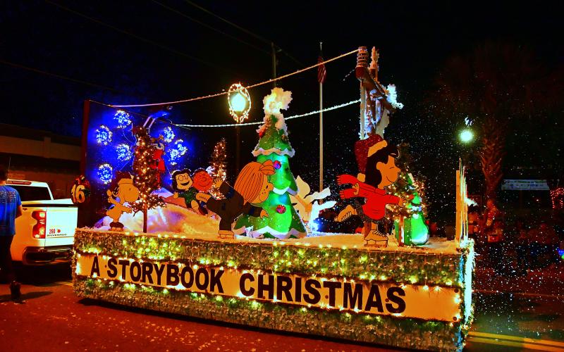 A float featuring characters from Peanuts rides along the parade route during the 2022 Christmas on the Square festivities in Live Oak. (ROB WOLFE/Special to the Reporter)