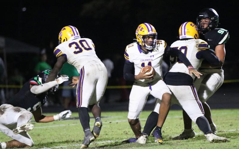 Columbia quarterback Zack Paulk steps up in the pocket to scramble away from pressure against Choctawhatchee during Friday’s Region 1-3S quarterfinal. (JORDAN KROEGER/Lake City Reporter)