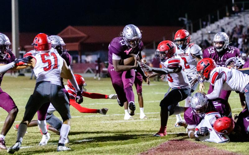 Madison County running back Ryshard Miller leaps past the Lafayette defense into the end zone for a touchdown during Friday’s Region 3-1R semifinal. (JACK HOWDESHELL/Special to the Reporter)