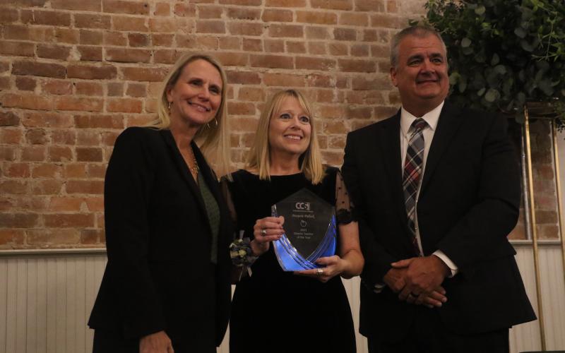 Westside Elementary’s Marjorie Pollock was named the Columbia County School District’s Teacher of the Year on Wednesday night. Pollock received her award from School Board Chair Dana Brady-Giddens (left) and Superintendent Lex Carswell. (MORGAN MCMULLEN/Lake City Reporter)