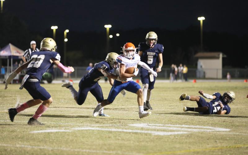 Branford receiver Austin Malaguti runs through the Bishop McLaughlin Catholic defense last Friday. (ERIN ROBERTS/Special to the Reporter)