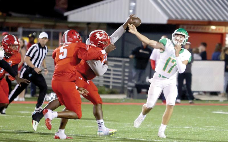 A Bradford defender deflects the ball directly out of Suwannee quarterback Koy Frier’s hand Friday night. Tornadoes linebacker Duke Lewis (5) intercepted the ball and returned it for a touchdown. (PAUL BUCHANAN/Special to the Reporter)