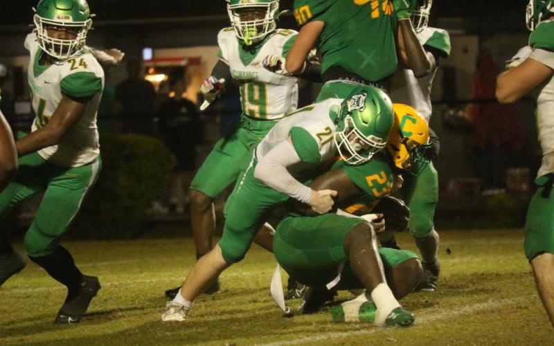 Suwannee defensive lineman Hunter Watson wraps up Pensacola Catholic running back Nigel Nelson on Friday night. (JAMIE WACHTER/Lake City Reporter)