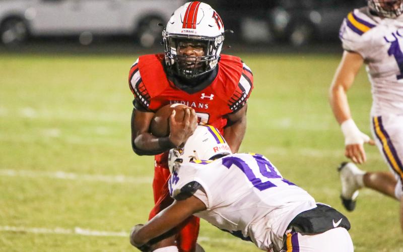 Fort White receiver Najeeb Smith is hit hard by Union County defensive back Bryan Tyson during Friday’s Region 3-1R semifinal. (BRENT KUYKENDALL/Lake City Reporter)
