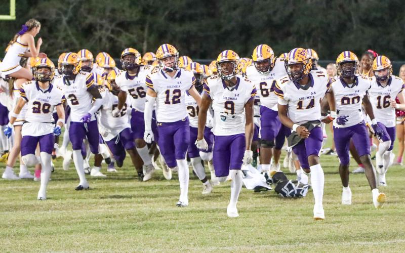 Columbia’s football team takes the field prior to a matchup against Ridgeview on Oct. 27. (BRENT KUYKENDALL/Lake City Reporter)