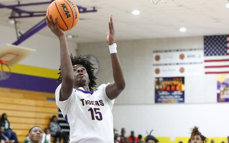 Columbia forward Zavian Douglas makes a layup against Suwannee on Nov. 28. (BRENT KUYKENDALL/Lake City Reporter)