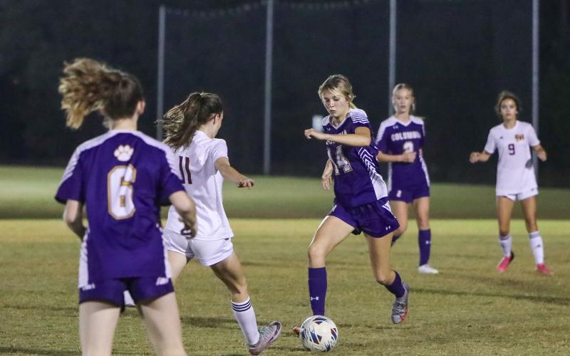Columbia's Mia Brasel dribbles up the field against Florida High on Dec. 1. (BRENT KUYKENDALL/Lake City Reporter)