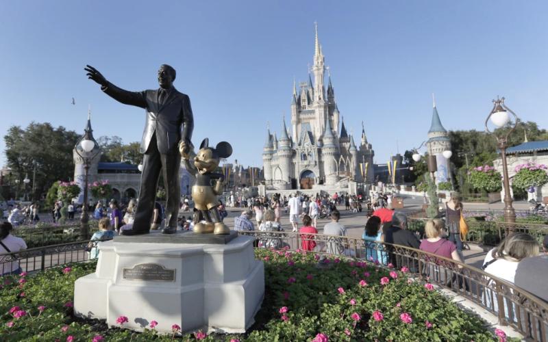 A statue of Walt Disney and Mickey Mouse appears in front of the Cinderella Castle at the Magic Kingdom theme park at Walt Disney World in Lake Buena Vista. (JOHN RAOUX/Associated Press)