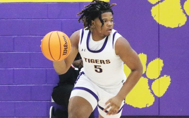 Columbia forward Jalen Gaskins dribbles up the court against Orange Park on Dec. 14. (JORDAN KROEGER/Lake City Reporter)
