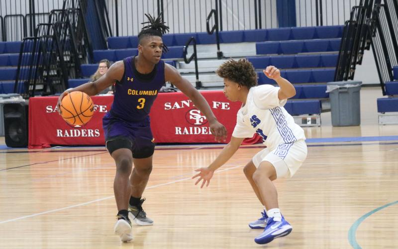 Columbia guard Zamarion Jones initiates the offense against South Dade during the Hitchcock's Challenge on Thursday. (JORDAN KROEGER/Lake City Reporter)