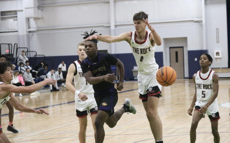 Columbia guard Zamarion Jones fires a pass through The Rock defense during the Hitchcock's Challenge on Saturday. (JORDAN KROEGER/Lake City Reporter)