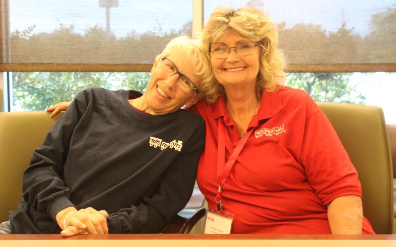 Inga Dwyer, the Toys for Tots coordinator for Columbia, Hamilton and Lafayette counties, (left) and Annita Leonard, the coordinator of Toys for Tots in Suwannee County, are looking forward to the Pilots With Presents Fly In &amp; Antinque and Classic Car Display on Saturday at the Lake City Gateway Airport. (TONY BRITT/Lake City Reporter)