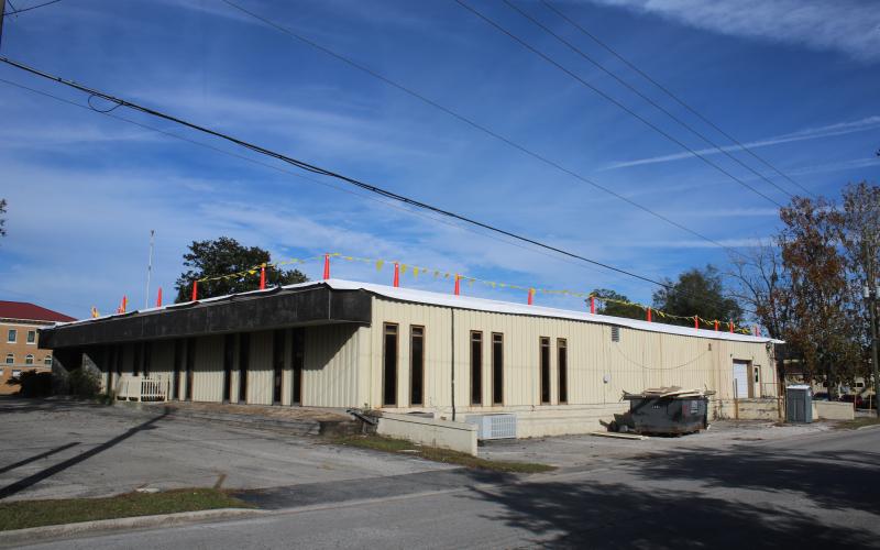 O’Neal Roofing is working on the roof of the old Lake City Reporter building, which Columbia County purchased earlier this year. (TONY BRITT/Lake City Reporter)