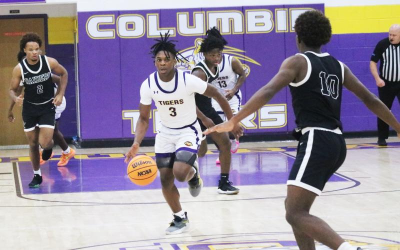 Columbia guard Zamarion Jones dribbles up the floor in transition during Thursday's game against Orange Park. (JORDAN KROEGER/Lake City Reporter)