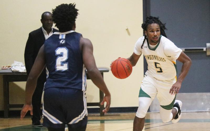 FGC guard Amayoa’ah Phillips dribbles the ball up the floor against Santa Fe College on Dec. 7. (JORDAN KROEGER/Lake City Reporter)