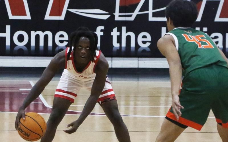 Fort White guard Najeeb Smith runs the offense against Eastside on Dec. 22. (MORGAN MCMULLEN/Lake City Reporter)