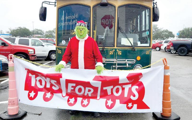 The Grinch made an appearance Saturday at the Suwannee County Toys for Tots’ ‘Stuff The Bus’ toy drive at Walmart in Live Oak. (COURTESY)