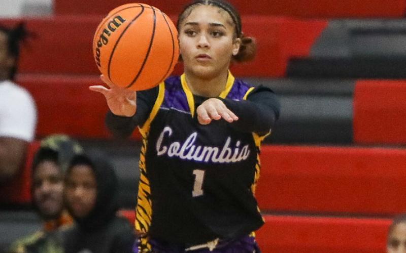 Columbia guard Mariah Cox fires a pass against Fort White on Jan. 16. (BRENT KUYKENDALL/Lake City Reporter)