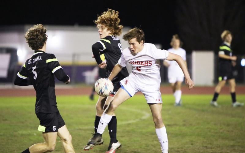 Columbia’s Brendan Schwartz (left) and Santa Fe’s Clayton Morgan battle for possession of the ball on Friday night. (BRENT KUYKENDALL/Lake City Reporter)