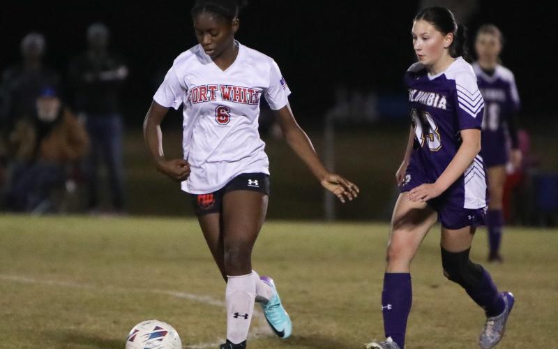 Fort White's Anndersn Fuller dribbles up the field against Columbia on Dec. 21, 2023. (BRENT KUYKENDALL/Lake City Reporter)