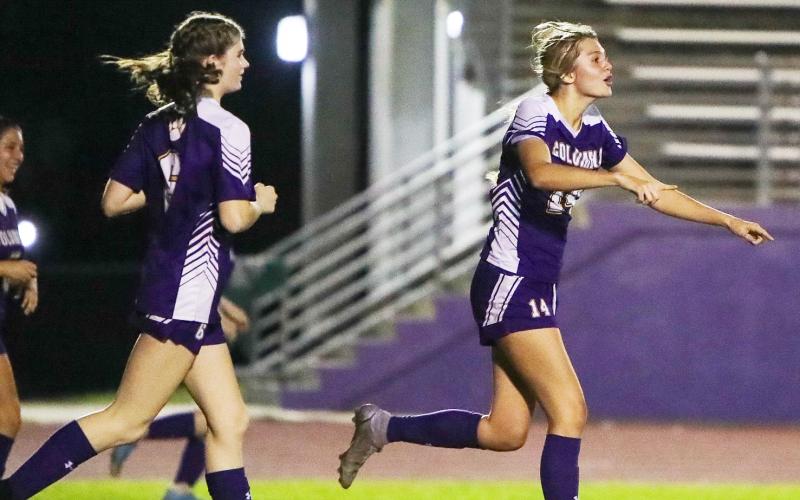 Columbia forward Mia Brasel celebrates one of her goals in the first half of Wednesday night’s District 2-5A quarterfinal against Rickards. (BRENT KUYKENDALL/Lake City Reporter)