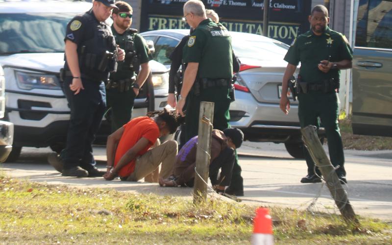Two individuals are detained following the crash Wednesday afternoon. A suspect was taken into custody but their name was not released Wednesday. (TONY BRITT/Lake City Reporter)