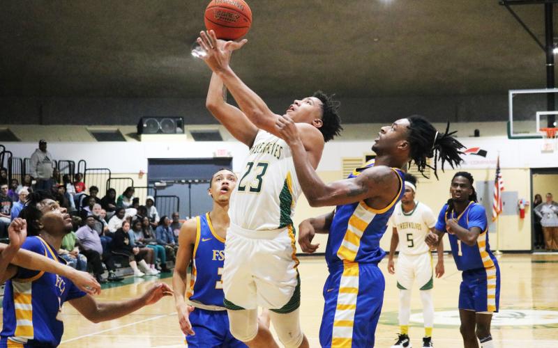 FGC forward Joseph Mitchell gets up a shot against the FSCJ defense on Wednesday night. (JORDAN KROEGER/Lake City Reporter)