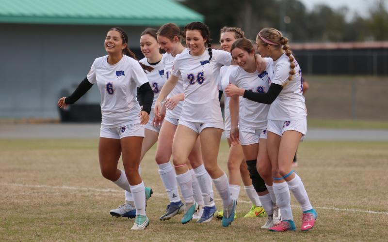Branford players celebrates a goal by Savannah Creech (18) during Saturday's match against Fort White. (PAUL BUCHANAN/Special to the Reporter)