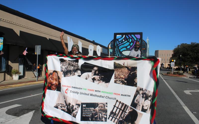 Pamela Green, the pastor at Trinity United Methodist Church, waves from the church’s entry in last year’s Martin Luther King Jr. Day parade. (FILE)