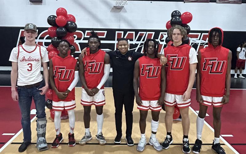 Fort White held Senior Night on Saturday against Baker County. Pictured are Garrett Brady (from left, Brandon Lumpkins, Maliki Clark, head coach Elvin Sheppard, Najeeb Smith, Brandon DeMartino and Percyse Bohler. (COURTESY)