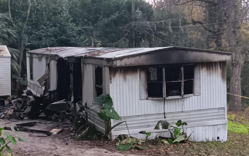One person was sent to the hospital after a mobile home on NW Ridgewood Avenue caught fire Monday morning. (TONY BRITT/Lake City Reporter)