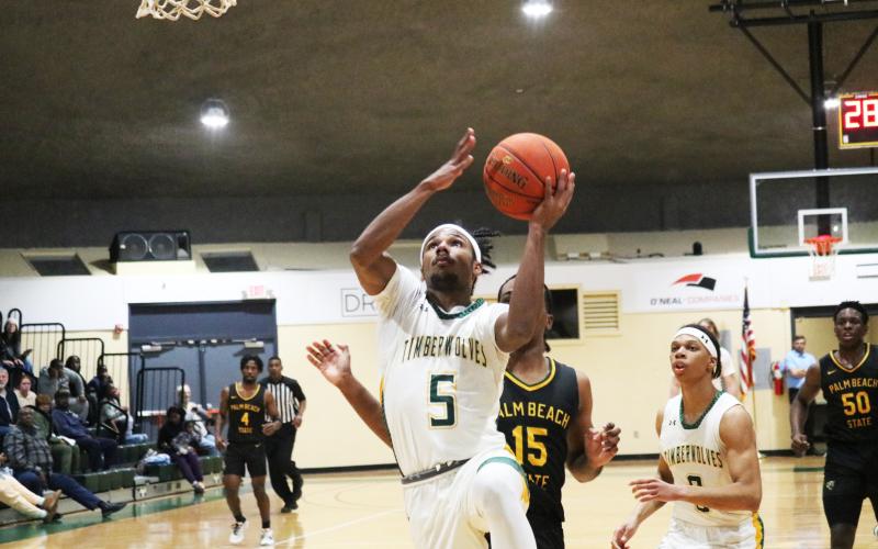 FGC guard Amayoa’ah Phillips rises for a layup against Palm Beach State College on Wednesday night. (JORDAN KROEGER/Lake City Reporter)