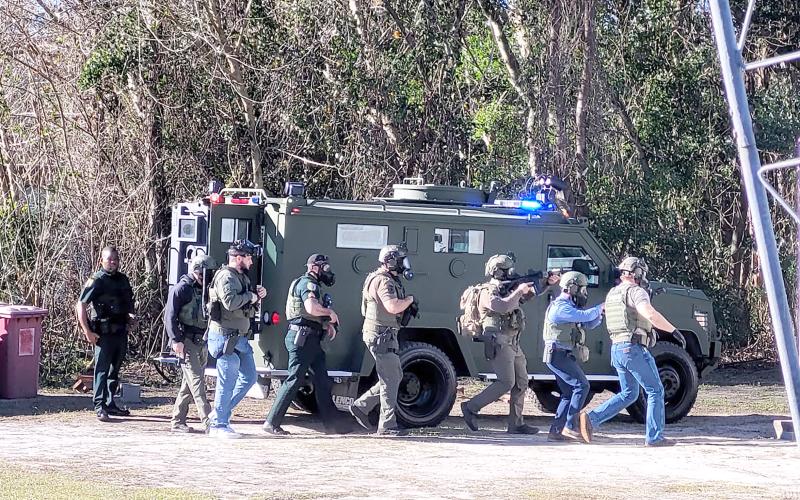 Members of the Columbia County Sheriff’s Office SWAT team gather near the camper Wednesday morning. (COURTESY COLUMBIA COUNTY SHERIFF’S OFFICE)