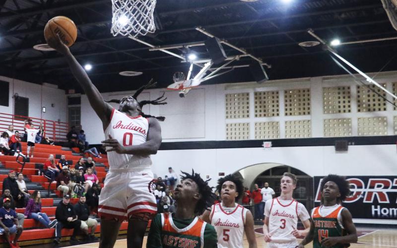 Fort White guard Najeeb Smith makes a layup against Eastside on Dec. 22. (MORGAN MCMULLEN/Lake City Reporter)
