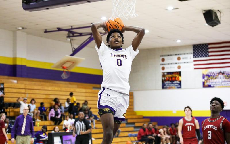 Columbia guard Noah Wilson rises for a dunk against Lowndes on Tuesday night. (BRENT KUYKENDALL/Lake City Reporter)
