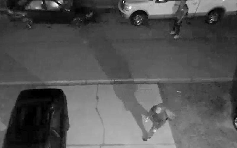 A still image from video surveillance released by the Lake City Police Department shows suspects checking out vehicles to burglarize. (COURTESY)