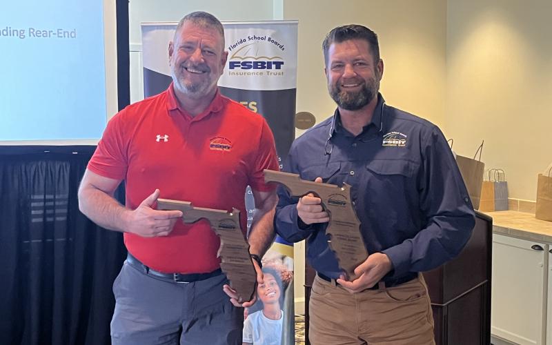 Lafayette County Schools’ Gerald Powers (left) and Robby Edwards received awards from the Florida School Boards Insurance Trust last month for risk management. (COURTESY)