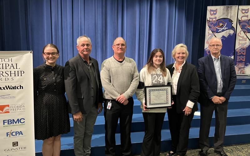 Branford High Principal Terry Huddleston was recognized as a Florida TaxWatch Principal Leadership Awards recipient Tuesday. Pictured with Huddleston (right) are Florida TaxWatch's Meg Cannon (from left), Suwannee County School Board member Ronald White, Suwannee County Superintendent Ted Roush, BHS senior Kaylynn Dees (who Huddleston selected to receive a full two-year scholarship) and Florida Prepaid College Foundation Director Cynthia O’Connell. (COURTESY)