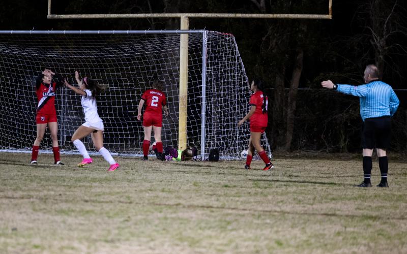 University Christian's Abby Mehm celebrates in front of the Lafayette net after scoring the go-ahead goal in overtime of Tuesday's Region 1-2A quarterfinal. (JACK HOWDESHELL/Special to the Reporter)