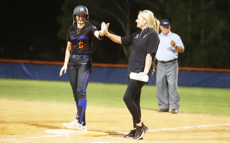 Branford's Madyson Sikes high fives an assistant coach duirng a game last season. (PAUL BUCHANAN/Special to the Reporter)