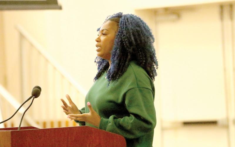 Vanessa George with Twentyeight Fourteen and October Realty presents the public-private partnership ask of $1 million from the County Commission to build affordable housing in Lake City. (JAMIE WACHTER/Lake City Reporter)
