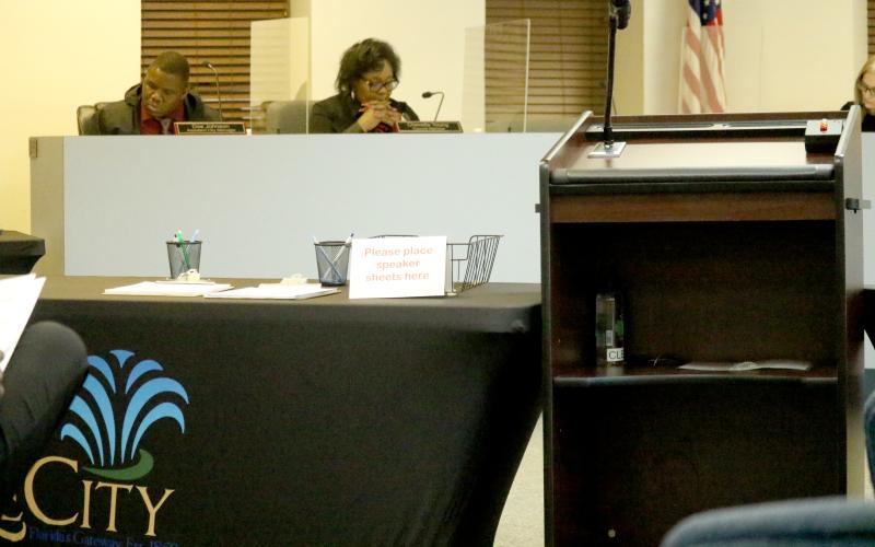 A table is set up next to the speaker’s lectern at Lake City Hall on Monday. City officials set up tables to keep residents away from the dais for Monday’s meeting. (JAMIE WACHTER/Lake City Reporter)