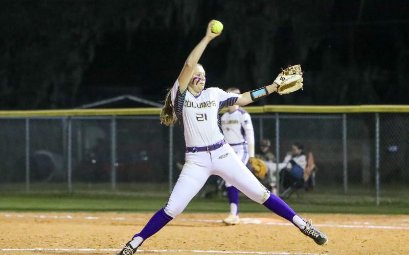 Columbia pitcher Harleigh Price winds up to pitch against Branford on Feb. 22. (BRENT KUYKENDALL/Lake City Reporter)
