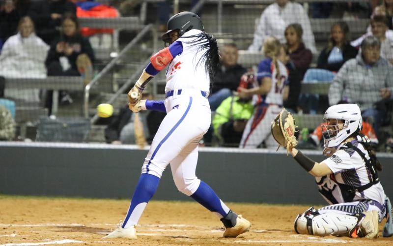 Branford's Mallory Blue swings at a pitch against Columbia on Feb. 22. (BRENT KUYKENDALL/Lake City Reporter)
